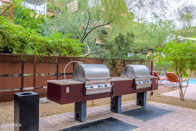 view of patio featuring a grill