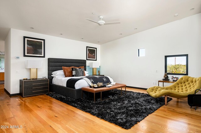 bedroom with ceiling fan and wood-type flooring