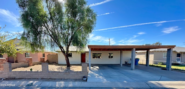 single story home featuring a carport