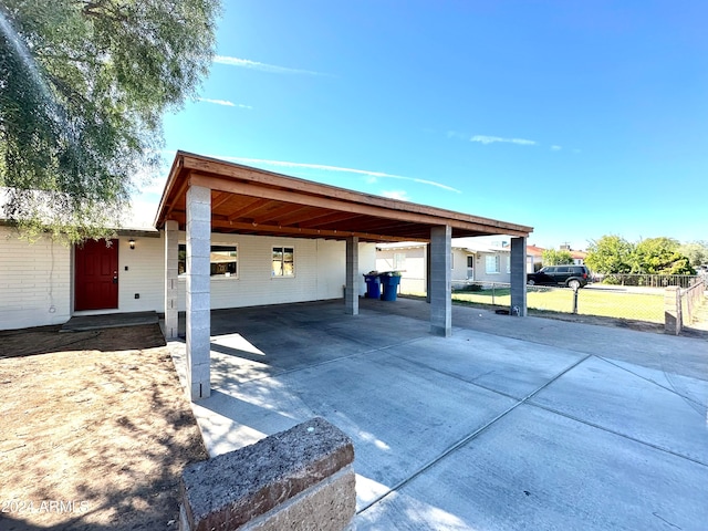 exterior space with a carport