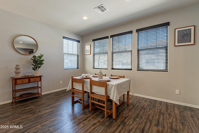 dining area with recessed lighting, dark wood finished floors, visible vents, and baseboards