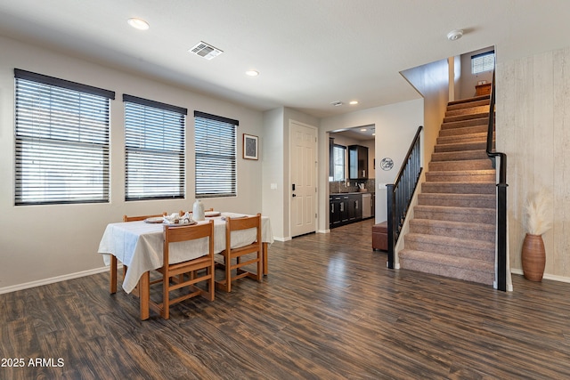 dining area with dark wood-style flooring, recessed lighting, visible vents, baseboards, and stairs