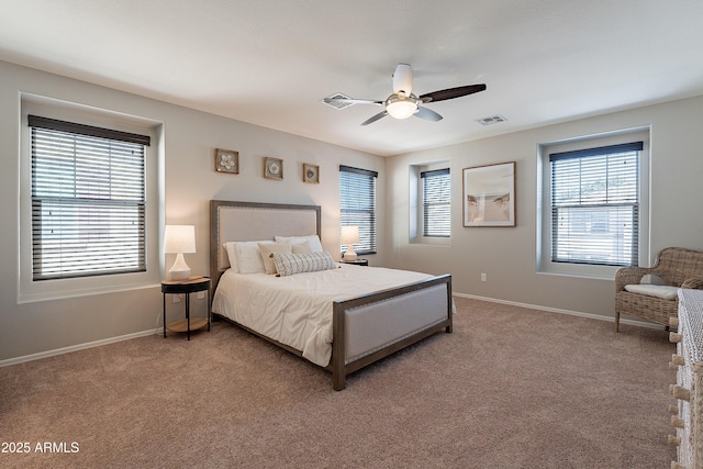 bedroom with light carpet, a ceiling fan, visible vents, and baseboards