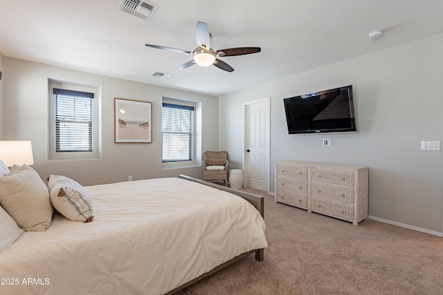 bedroom featuring a ceiling fan, baseboards, visible vents, and carpet flooring