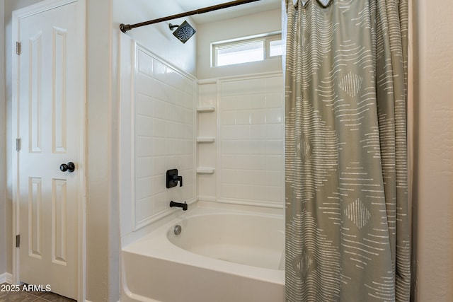 bathroom with shower / bath combo with shower curtain