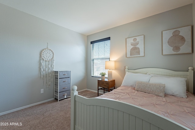 bedroom with carpet floors and baseboards