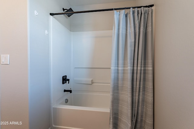 full bathroom featuring shower / bath combo with shower curtain