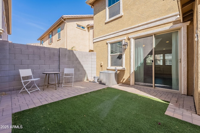 view of patio / terrace with fence and central AC unit