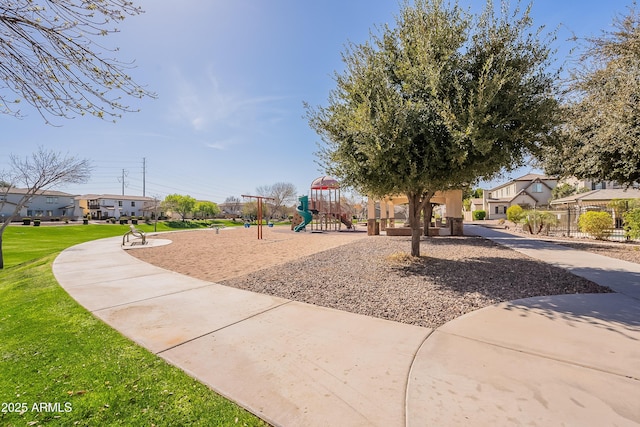 community play area with a yard and a residential view