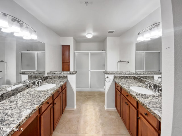 bathroom featuring tile floors and vanity