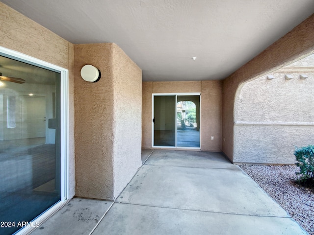 entrance to property with a patio area