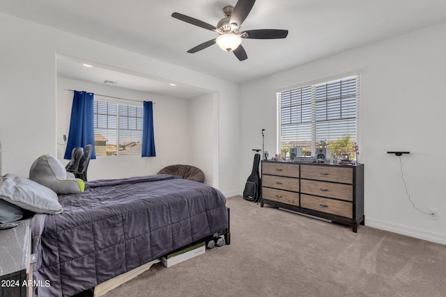 carpeted bedroom with ceiling fan