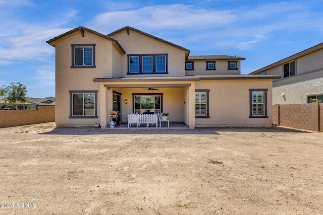 back of house with a patio area and ceiling fan