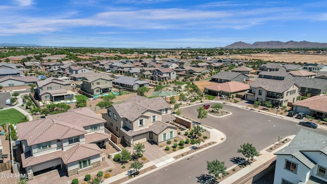 birds eye view of property featuring a mountain view