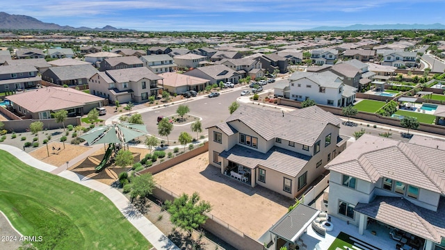 birds eye view of property with a mountain view