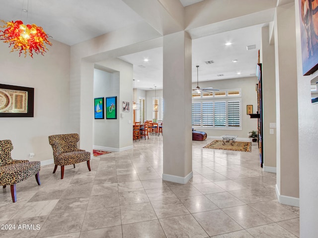 interior space featuring a notable chandelier and light tile patterned floors