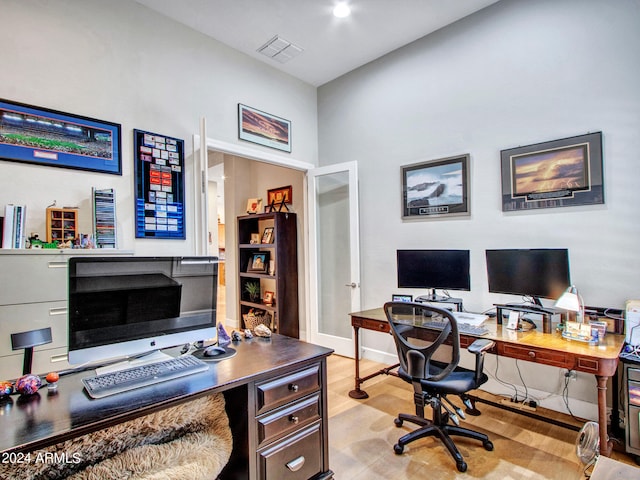 office space with light hardwood / wood-style flooring