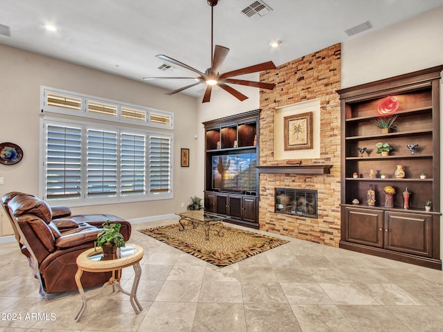 tiled living room featuring a fireplace, ceiling fan, and built in features