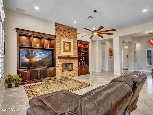 living room with ceiling fan, a fireplace, built in features, and light tile patterned floors