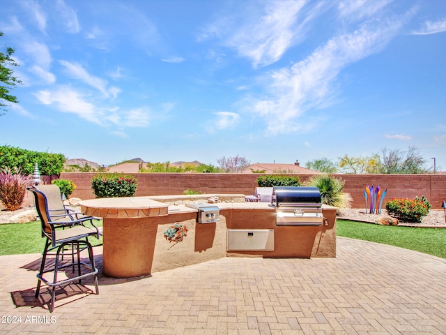 view of patio / terrace with exterior kitchen and area for grilling