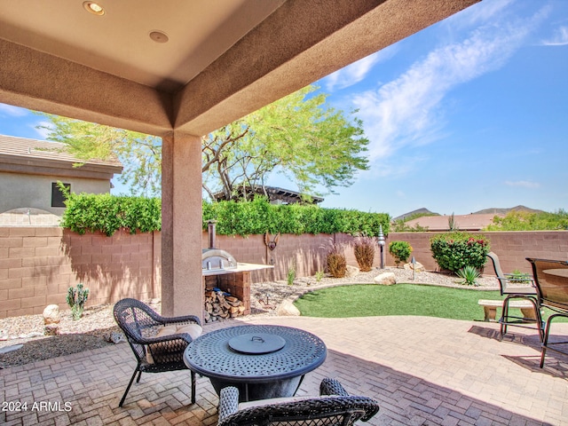 view of patio featuring a fire pit