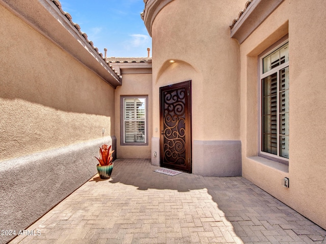 entrance to property with a patio