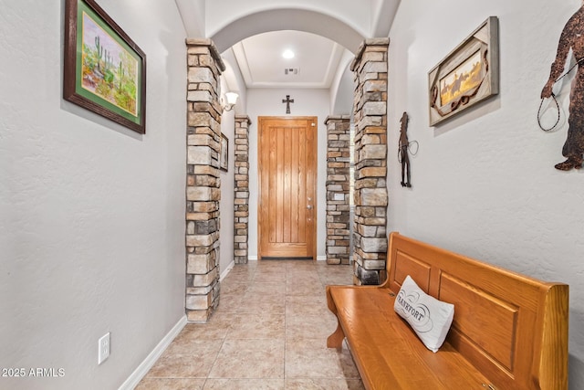 corridor featuring light tile patterned flooring