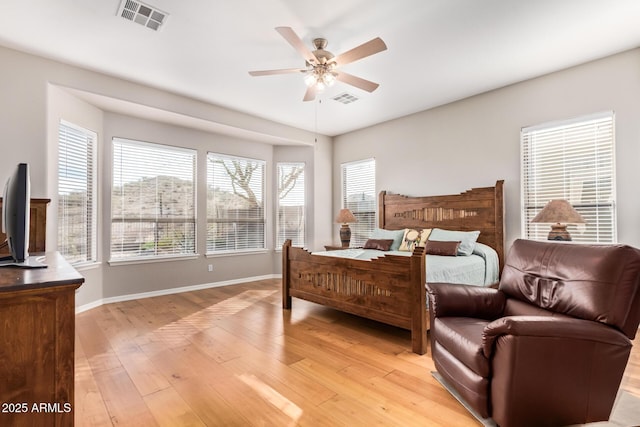 bedroom featuring light hardwood / wood-style flooring and ceiling fan