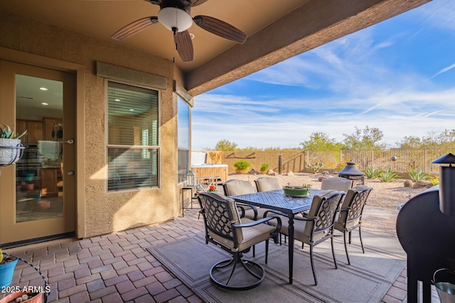 view of patio featuring ceiling fan