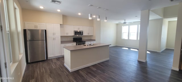 kitchen featuring stainless steel appliances, a sink, visible vents, and white cabinetry