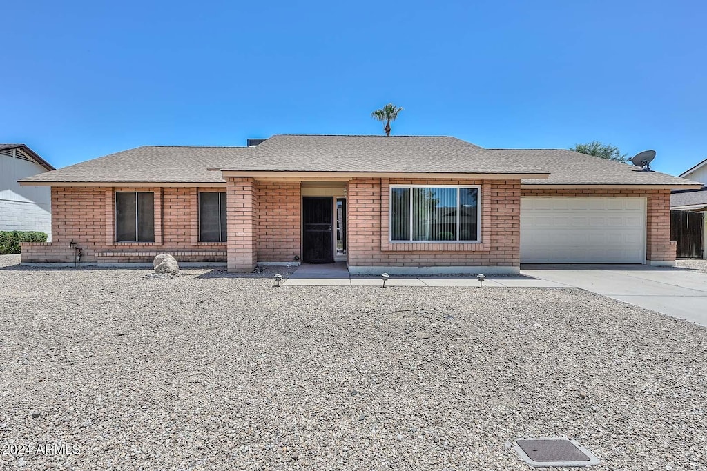 single story home with a garage