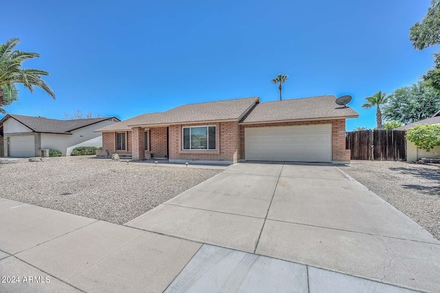 ranch-style house featuring a garage