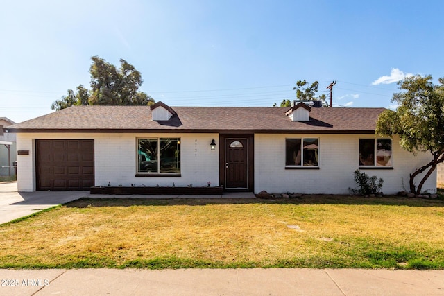 single story home with an attached garage, brick siding, driveway, roof with shingles, and a front yard