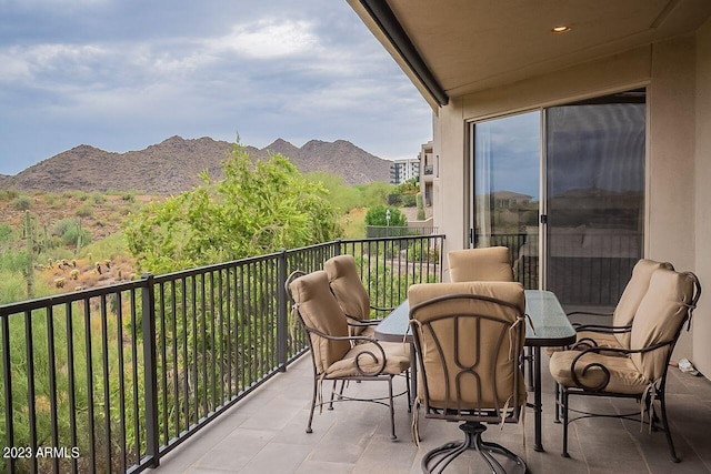 balcony featuring a mountain view