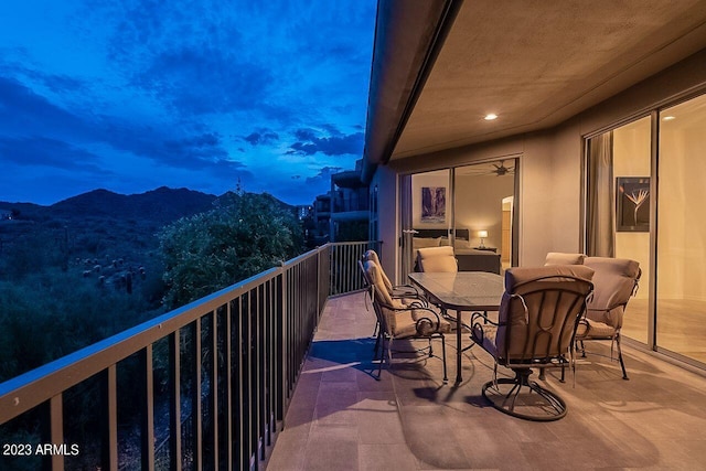 balcony at dusk with a mountain view