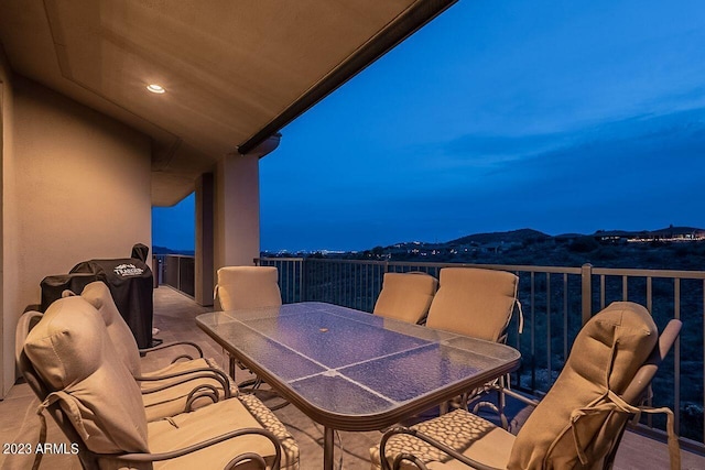 view of balcony at dusk