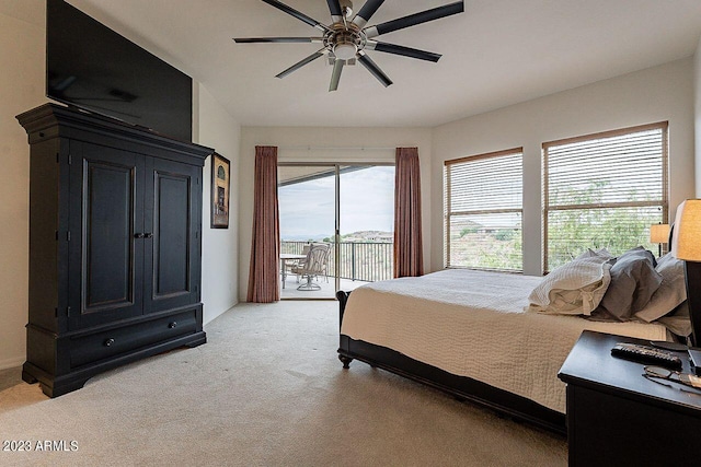 carpeted bedroom featuring access to outside and ceiling fan