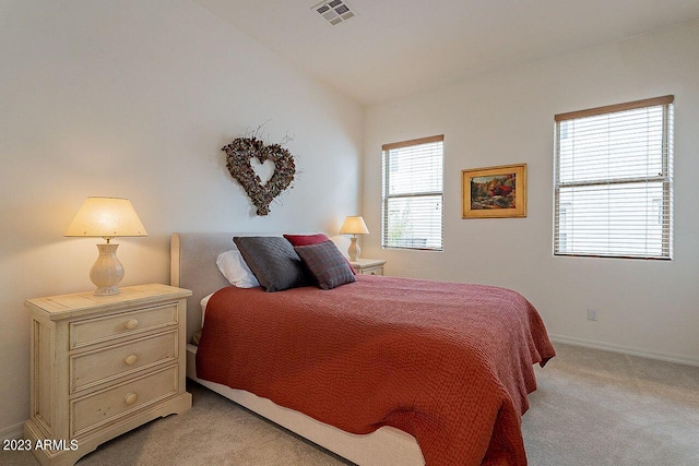 carpeted bedroom featuring lofted ceiling