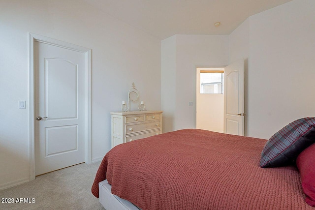 bedroom featuring light colored carpet