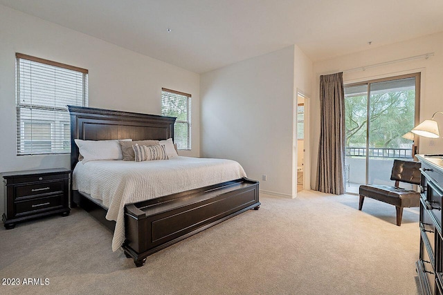 carpeted bedroom with access to exterior