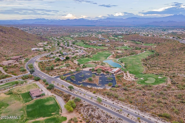 aerial view featuring a water and mountain view