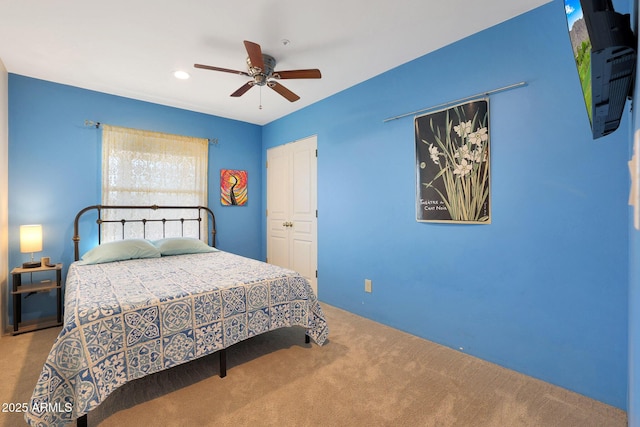 bedroom featuring ceiling fan and a closet