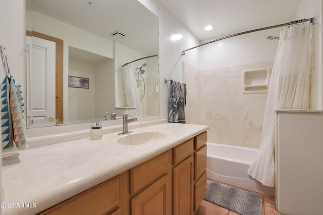 bathroom with shower / bath combo with shower curtain, tile patterned flooring, and vanity