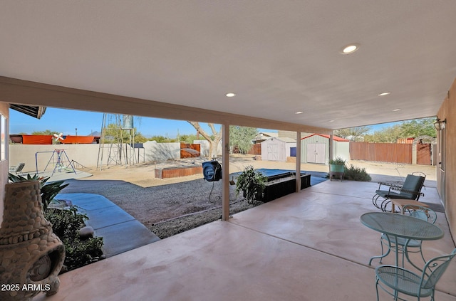 view of patio / terrace with a storage shed