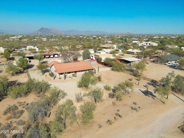 birds eye view of property featuring a mountain view