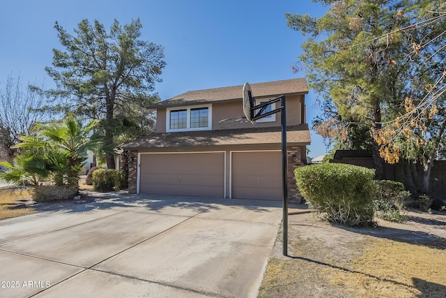 traditional-style house featuring a garage, brick siding, driveway, and stucco siding