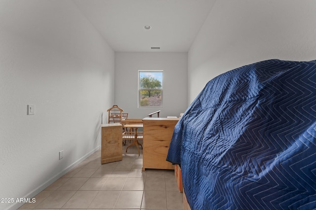 bedroom featuring light tile patterned flooring, baseboards, and visible vents