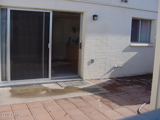 property entrance with visible vents