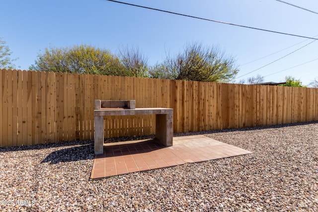 view of yard featuring a fenced backyard and a patio area