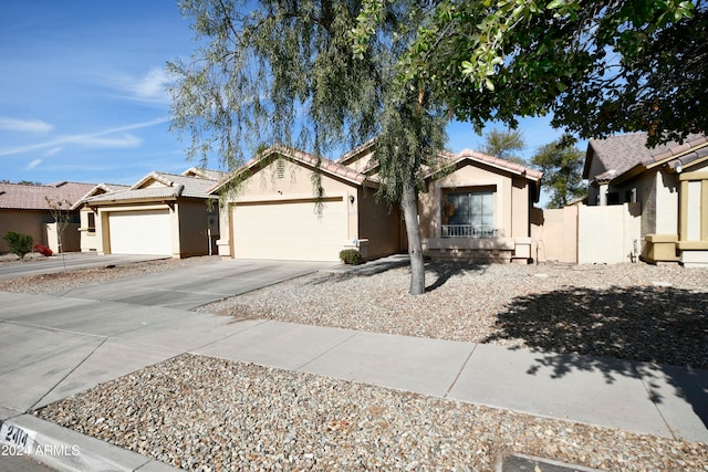 ranch-style house featuring a garage